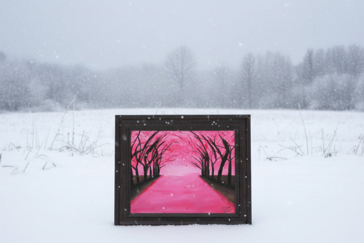 Framed pink artwork on a snowy landscape